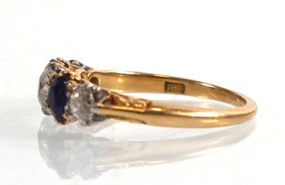 Lot 794 - An 18ct yellow gold ring set three graduated...