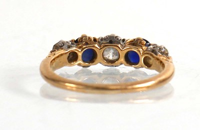 Lot 794 - An 18ct yellow gold ring set three graduated...