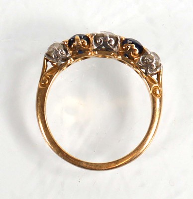 Lot 794 - An 18ct yellow gold ring set three graduated...