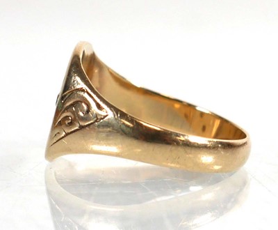 Lot 795 - A 9ct yellow gold signet ring set three small...