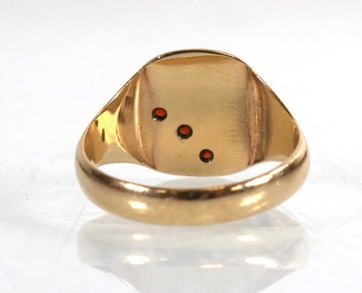 Lot 795 - A 9ct yellow gold signet ring set three small...