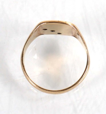 Lot 795 - A 9ct yellow gold signet ring set three small...