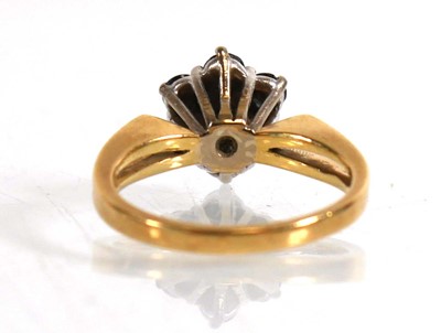 Lot 822 - An 18ct yellow gold cluster ring set seven...