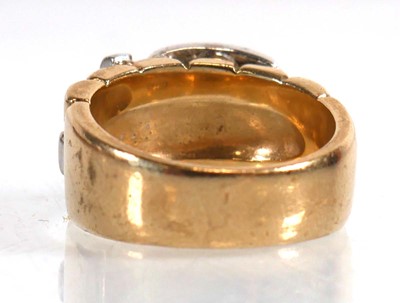 Lot 826 - A 9ct yellow gold buckle ring set small...