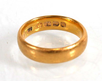 Lot 835 - A 22ct yellow gold wedding band, Birmingham...