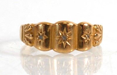 Lot 836 - An 18ct yellow gold ring set three small...