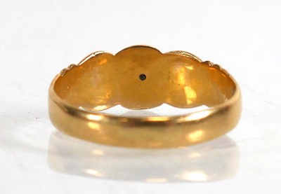 Lot 836 - An 18ct yellow gold ring set three small...