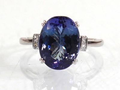 Lot 848 - A 14ct white gold ring set oval tanzanite...