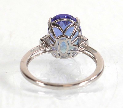 Lot 848 - A 14ct white gold ring set oval tanzanite...