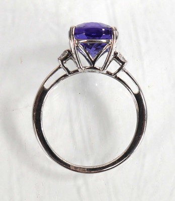 Lot 848 - A 14ct white gold ring set oval tanzanite...