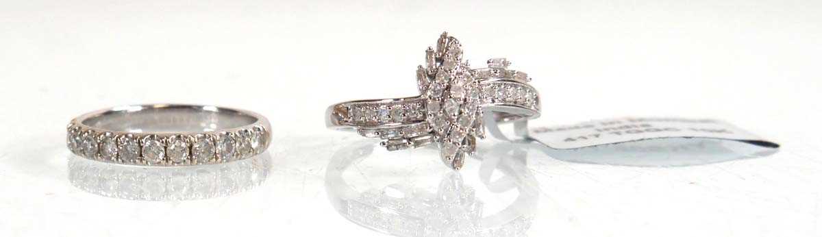 Lot 849 - A 9ct white gold ring set small diamonds in a...