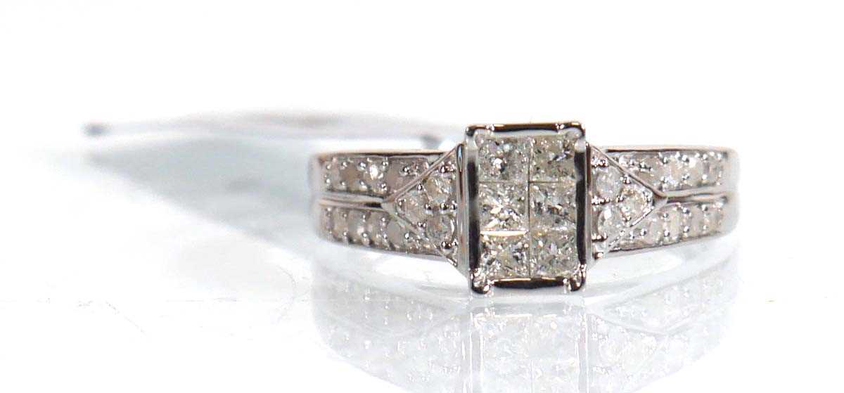 Lot 850 - A 9ct white gold ring set nine small princess...