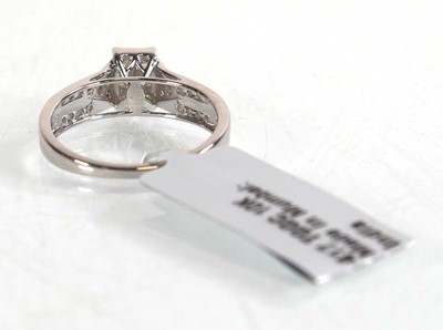 Lot 850 - A 9ct white gold ring set nine small princess...