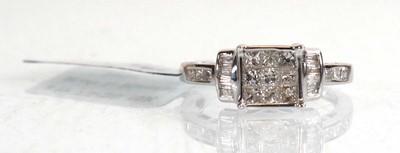 Lot 851 - A 9ct white gold ring set nine small princess...