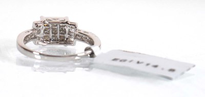 Lot 851 - A 9ct white gold ring set nine small princess...