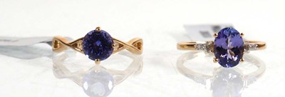 Lot 854 - A 14ct yellow gold ring set oval tanzanite...