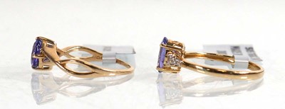 Lot 854 - A 14ct yellow gold ring set oval tanzanite...