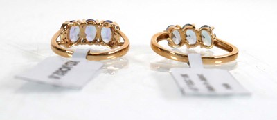 Lot 856 - A 9ct yellow gold ring set three oval...