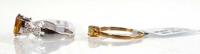 Lot 857 - A 9ct white gold ring set oval yellow stone...