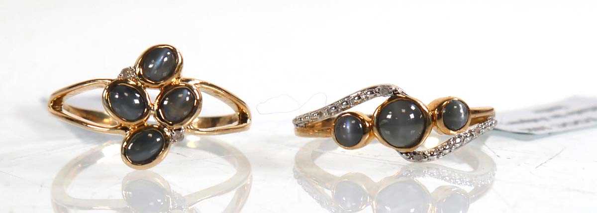 Lot 858 - Two 9ct yellow gold rings, each set grey...