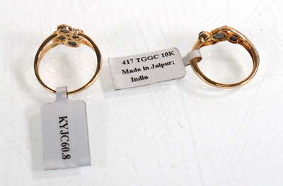 Lot 858 - Two 9ct yellow gold rings, each set grey...