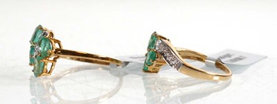 Lot 860 - Two 9ct yellow gold rings, each set four oval...