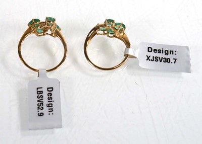 Lot 860 - Two 9ct yellow gold rings, each set four oval...