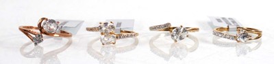 Lot 863 - Four 9ct yellow and rose gold rings, each set...