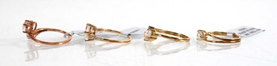 Lot 863 - Four 9ct yellow and rose gold rings, each set...