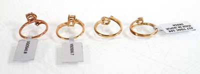 Lot 863 - Four 9ct yellow and rose gold rings, each set...