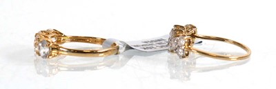 Lot 864 - A 9ct yellow gold ring set two rows of eleven...