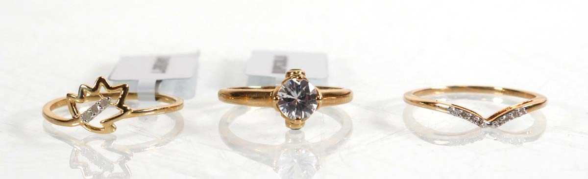 Lot 865 - A 9ct yellow gold ring set small diamonds in a...