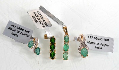 Lot 870 - Four 9ct yellow gold pendants, each set...