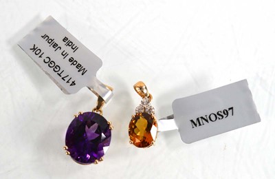 Lot 872 - A 9ct yellow gold pendant set purple stone, l....