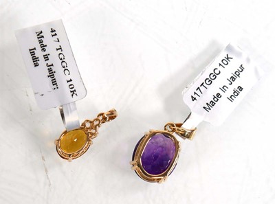 Lot 872 - A 9ct yellow gold pendant set purple stone, l....