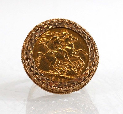 Lot 990 - A 9ct yellow gold ring set Edwardian sovereign...