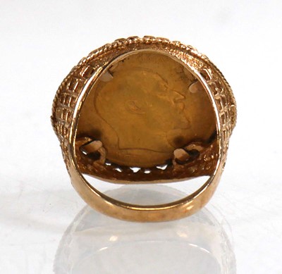 Lot 990 - A 9ct yellow gold ring set Edwardian sovereign...