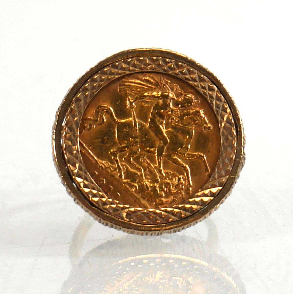 Lot 991 - A 9ct yellow gold ring set half sovereign...