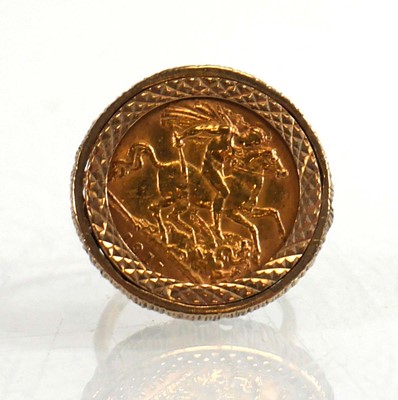 Lot 991 - A 9ct yellow gold ring set half sovereign...