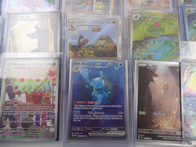 Lot Qty of Top Loaded Pokémon Cards to Include...