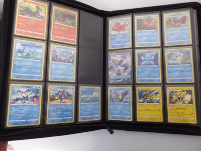 Lot x2 Binders containing an assortment of Pokemon...