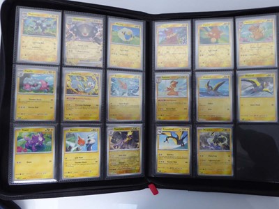 Lot x2 Binders containing an assortment of Pokemon...