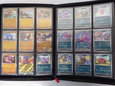 Lot x2 Binders containing an assortment of Pokemon...