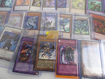 Lot Qty of Top Loaded Yu-Gi-Oh Cards to include...