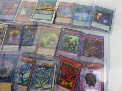 Lot Qty of Top Loaded Yu-Gi-Oh Cards to include...