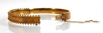 Lot 909 - An early 20th century 15ct yellow gold hinged...