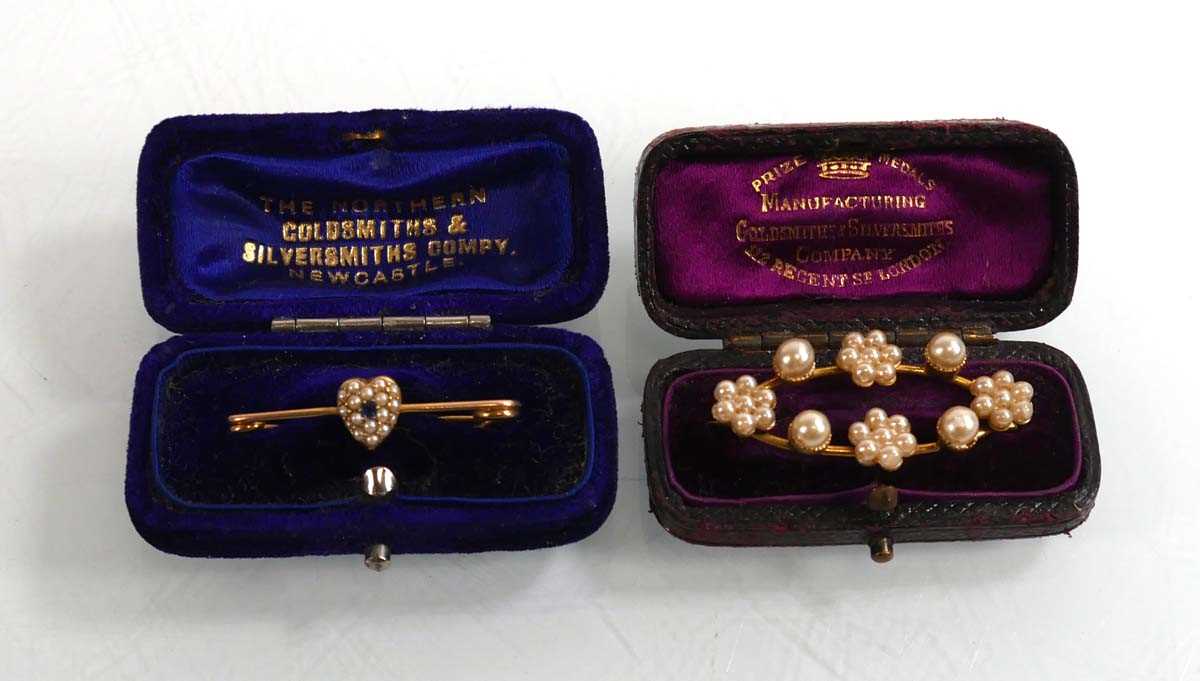 Lot 911 - A yellow metal bar brooch set seed pearls and...