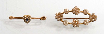 Lot 911 - A yellow metal bar brooch set seed pearls and...