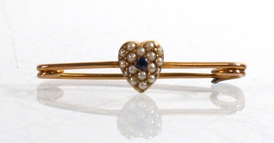 Lot 911 - A yellow metal bar brooch set seed pearls and...