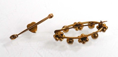 Lot 911 - A yellow metal bar brooch set seed pearls and...